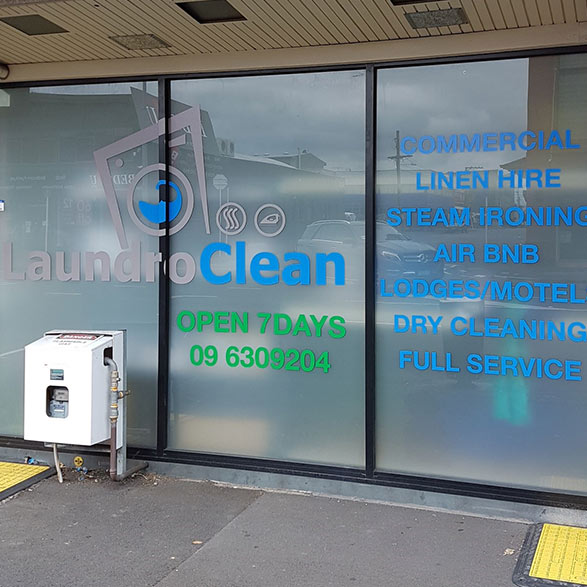 Gray Car in front of the Balmoral Drycleaners Store